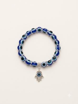 Handmade blue evil eye bracelet featuring premium blue beads and an elegant silver Hamsa hand charm.